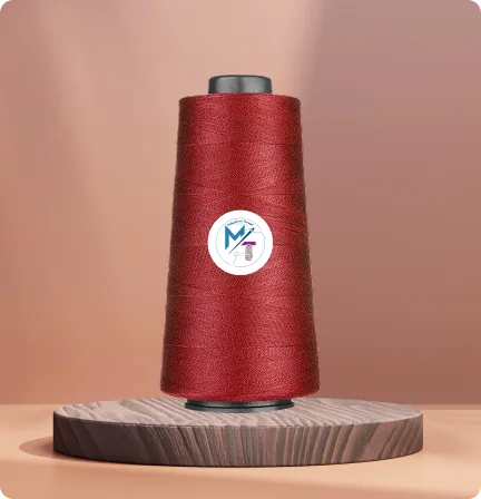 Cone of red industrial sewing thread on a display podium